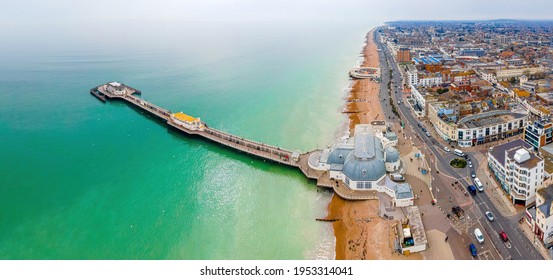 An aerial view of Worthing Pier, a public pleasure pier in Worthing, West Sussex, England, UK - Shutterstock ID 1953314041