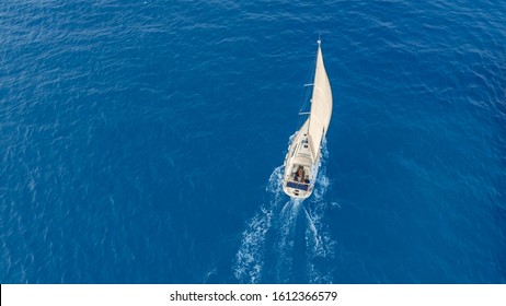 Aerial View Yacht Sailing On Opened Sea. Sailing Boat Yacht From Above. Yachting At Windy Day.