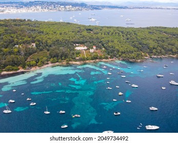 Aerial view of yachts between Ile Sainte Marguerite and Ile Saint Honorat in mediterranean sea. Ile Sainte Marguerite is the largest of Lerins Islands, near Cannes town in French Riviera. Drone view.