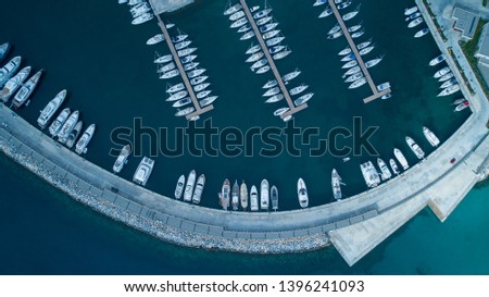 Aerial view of yachts and boat berthed in the marina and clear water. Aerial view of the Marina in Turkey. Holiday icons .