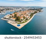 An aerial view of Zadar old city with Saint Anastasia Cathedral and Saint Donatus Church. Drone view taken on 22nd of October 2024 in Zadar, Zadar County, Croatia.