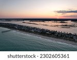 Aerial views from over downtown Wrightsville Beach North Carolina at sunset.