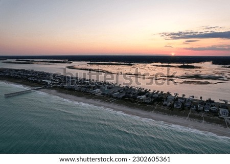 Aerial views from over downtown Wrightsville Beach North Carolina at sunset.