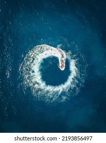 Aerial Wallpaper Of Boat Making A Circle