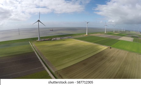 Aerial of wind turbine wind park view from above bird eye helicopter view green engineering near sea providing wind energy green energy renewable energy showing mast and blades aerofoil-powered 4k