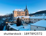 Aerial, winter view of an authentic renaissance castle Sternberk covered by snow against blue sky. Czech landscape, Central Moravia, Czech republic.