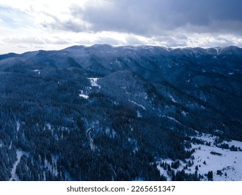 Aerial winter view of Rhodope Mountains around village of Stoykite and Pamporovo, Smolyan Region, Bulgaria