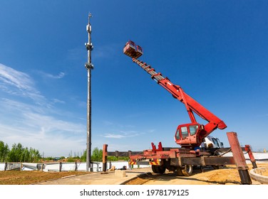 An Aerial Work Platform, Also Known As An Aerial Device, Elevating Work Platform, Cherry Picker, Bucket Truck, Mobile Elevating Work Platform Maintenances The Telecommunication Tower.