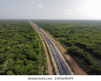 Aerial Yucatan tren maya train green construction trees rail