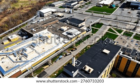 Aerially changing position over a facility that operates for the purpose of handling manufacturing for both clinical trials and commercial drug launches.