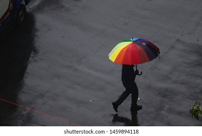 Aerial.Rain falling and colorful umbrella in rainy day on road. Mumbai Rain. - Shutterstock ID 1459894118
