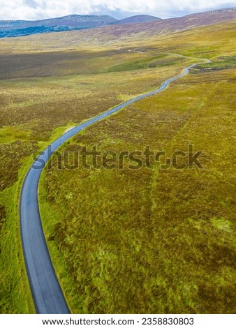 Aerialview of Road, Bogs with mountains in background in Sally gap, Wicklow, Ireland