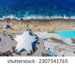 Aero Photography. View from flying drone. Panoramic cityscape of old town and an incredibly beautiful beach. San Paul il Bahar (San Pawl il-Baħar) Malta. Top 