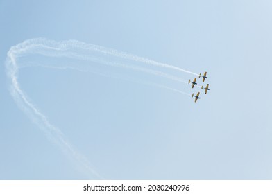 Aerobatic Maneuver Performed By A Group Of Four Aircrafts