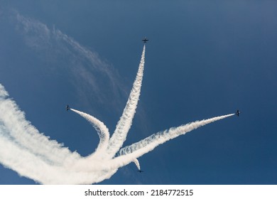 Aerobatics figure in the form of a tulip. City event, airshow