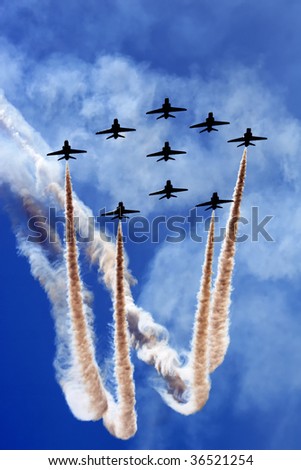 Aerobatics team flying in formation.