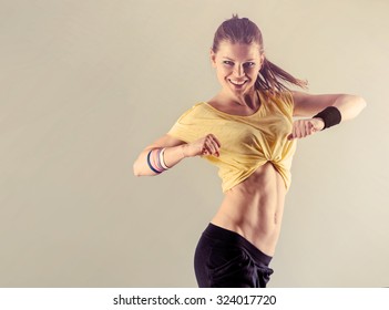 Aerobics Fitness Workout. Young Athletic Female Dancing Street Dance In Studio. Concept Of Sport And Health. 