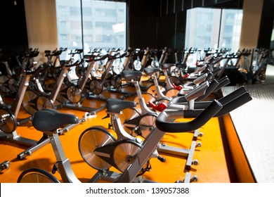 Aerobics Spinning Exercise Bikes Gym Room With Many In A Row