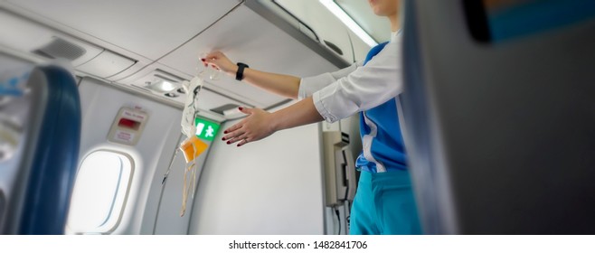 Aeroflot Shows How To Use An Oxygen Mask On Board, Air Hostess Demonstrate Safety Procedures To Passengers Prior Before Airplane Flight Take-off,banner For Website