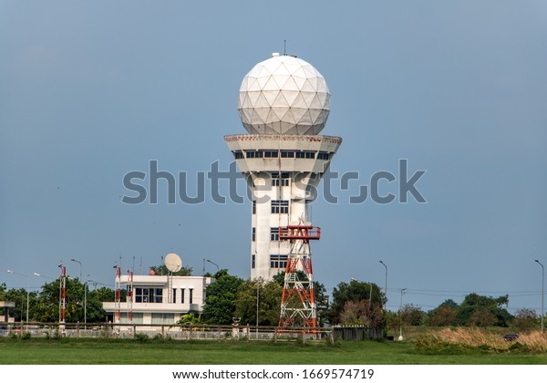 Aeronautical meteorological observations\
station tower with spherical radar antenna. Control tower with\
weather radar on airport, on blue sky\
background.