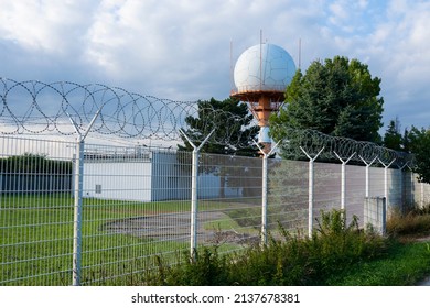 Aeronautical radar or aeronautical meteorological observations station tower with spherical radar antenna. Control tower with weather radar on airport. 