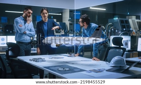 Aeronautics Factory Office Meeting Room: Team of Diverse Engineers and Managers Work on an Augmented Reality Airplane Jet Engine Simulation. Advanced Industry 4.0 Research and Development Test.