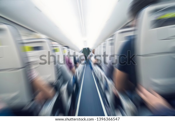 aerophobias concept. plane shakes during turbulence\
flying air hole. Blur image commercial plane moving fast downwards.\
Fear of flying. collapse slump, depression, downfall, debacle,\
subsidence. dive