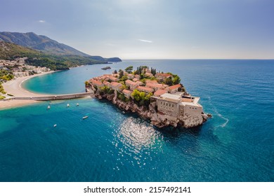 Aerophotography. View from flying drone. Panoramic view of Sveti Stefan island in Budva in a beautiful summer day, Montenegro. Top View. Beautiful destinations - Shutterstock ID 2157492141
