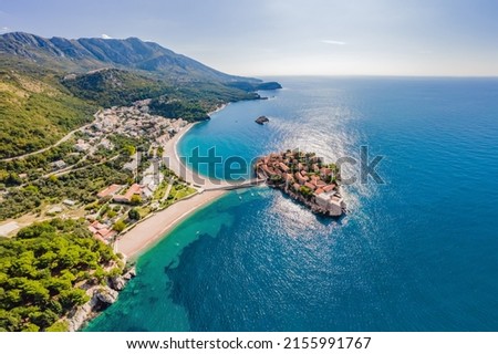 Aerophotography. View from flying drone. Panoramic view of Sveti Stefan island in Budva in a beautiful summer day, Montenegro. Top View. Beautiful destinations