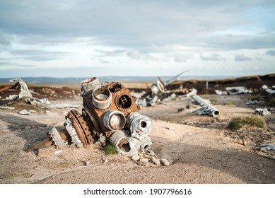 Aeroplane crash site B29 WW2 USA Army American US Airforce bomber plane crashed pieces of rusty aircraft engine parts. Aeroplane superfortress wreckage strewn across landscape destroyed in explosion