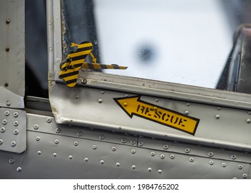 Aeroplane jet rescue pilots canopy release with yellow arrow and text pointing to pull cord for emergency exit.