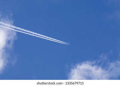 Aeroplane Vapor Trails In Jet Stream From Jet Aircraft.