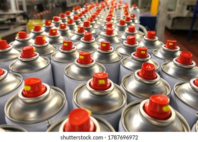 Aerosol cans in busy factory 
