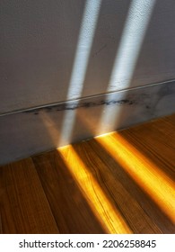 Aesthetic Close Up Shot Of Wooden Flooring Joint With White Marble Wall And White Wall Finish Sun Shading Or Sun Shined With Sun Ray Shadowing Pattern For Architectural Background Ideas