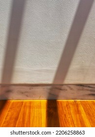 Aesthetic Close Up Shot Of Wooden Flooring Joint With White Marble Wall And White Wall Finish Sun Shading Or Sun Shined With Sun Ray Shadowing Pattern For Architectural Background Ideas