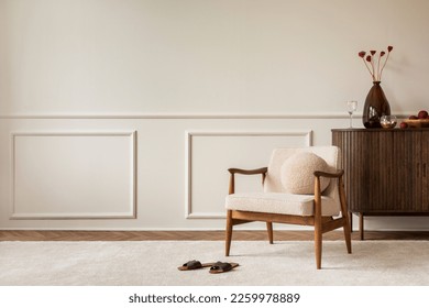 Aesthetic composition of living room interior with copy space, boucle armchair, vase with dried flowers, round pillow, wooden sideboard, beige rug and personal accessories. Home decor. Template.