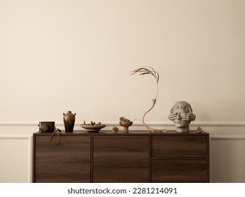 Aesthetic composition of living room interior with wooden sideboard, glass vase with dried flowers, modern sculpture, nuts, wall with stucco and personal accessories. Home decor. Template.