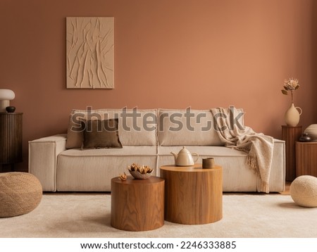 Aesthetic composition of living room interior with mock up poster frame, modular sofa, wooden coffee table, vase with dried flowers, pillows, armchair and personal accessories. Home decor. Template. 