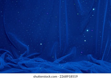 Aesthetic, elegant dark blue tulle fabric with sequins on black background. Starry night composition. - Powered by Shutterstock