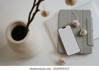 Aesthetic flat lay of minimalist home office with smartphone, tablet and ceramic vase. Neutral tones and natural elements Cozy elegant workspace - Powered by Shutterstock