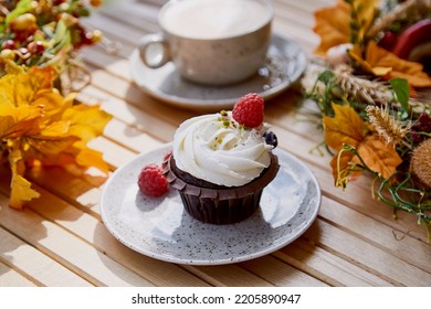 Aesthetic French Gluten And Sugar Free Cupcake Close Up Among Autumn Atmospheric Decoration And Cup Of Coffee. Cozy Breakfast.