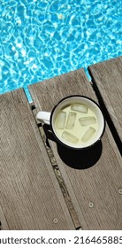 Aesthetic Milk Matcha Beverage Near Pool, Portraying Summer Vibes.