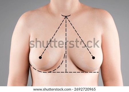 Aesthetic plastic surgery for breasts of different sizes, reduction mammoplasty, healthcare and medicine concept on gray studio background