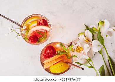 Aesthetic refreshing trendy non alcoholic classic Negroni drink with citrus. Summer detox cold cocktails flat lay. - Shutterstock ID 2317876477