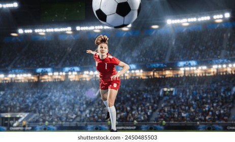 Aesthetic Shot Of Athletic Female Soccer Football Player Doing A Head Kick On Stadium With Crowd Cheering. International Championship Final Match on Arena Full Of Loyal Fans Of The Team. - Powered by Shutterstock