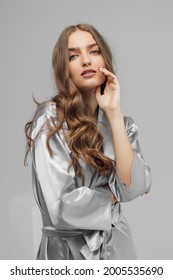 Aesthetic Woman's Portrait In Satin Bathrobe On White Background