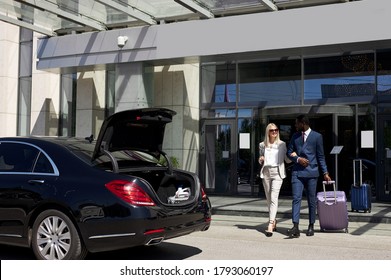 Affable Hotel Clerk Serve Business Client, Confident And Polite Black Man In Formal Wear Help Lady To Reach The Car With Convenience