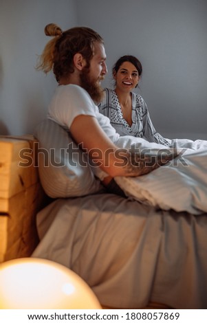 Cheerful couple of lesbian women in love at home