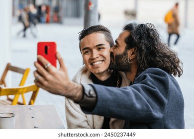 Affectionate gay couple taking a selfie - Powered by Shutterstock