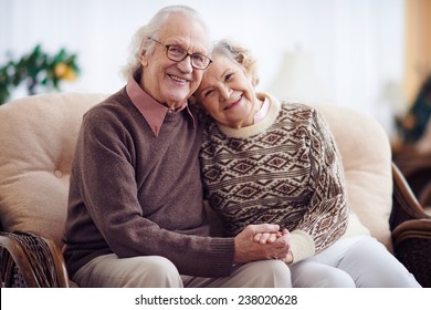 Affectionate grandparents having rest at home